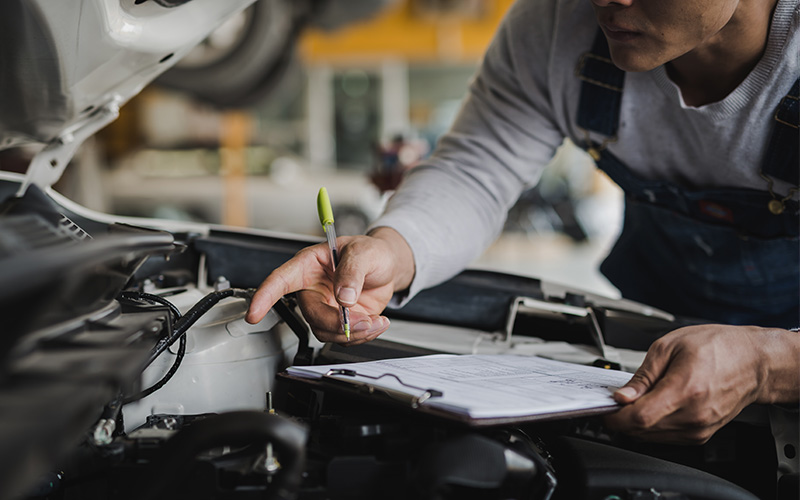 Technician performing a Buick vehicle inspection